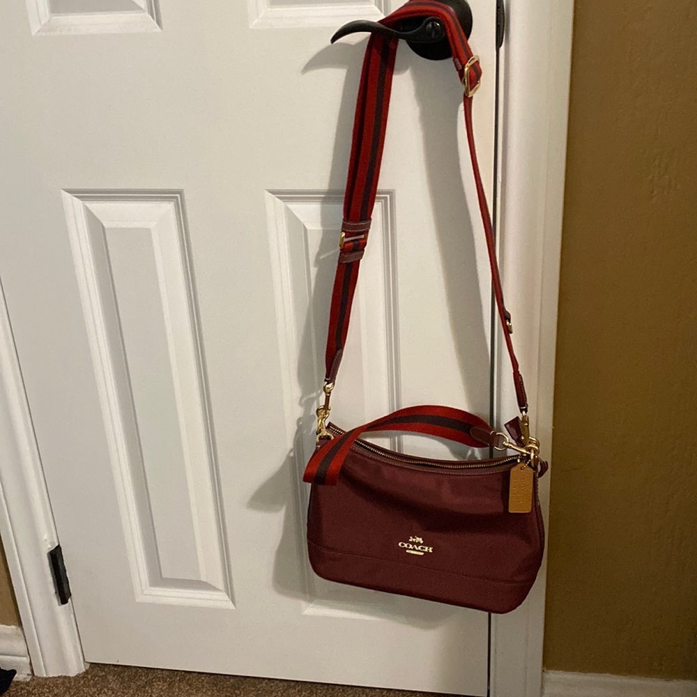 Coach shoulder bag with strap for shoulder and arm. New, never used. 10w X  7 L
